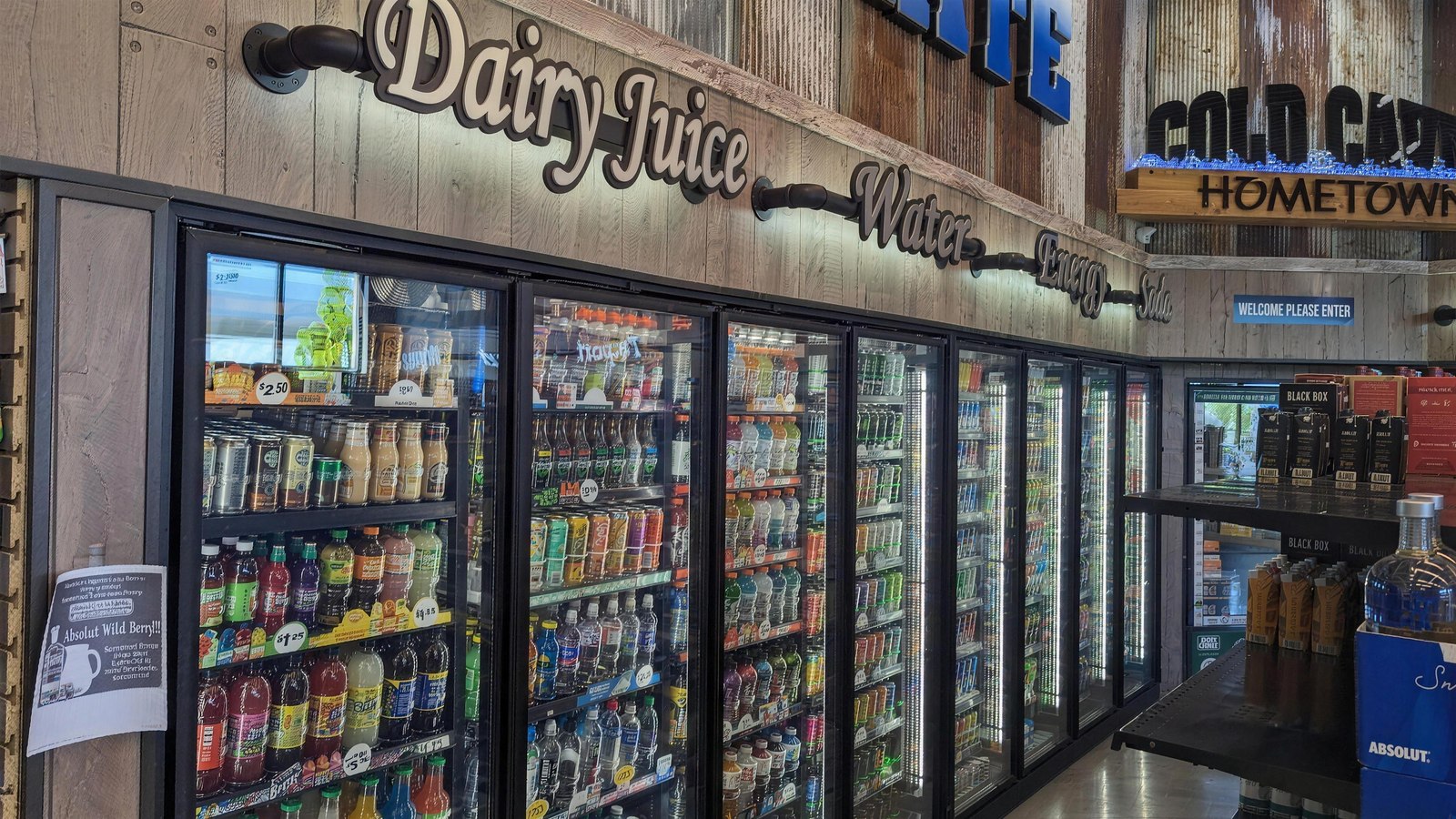 The cold beverage wall — dairy, juice, water, energy, and soda coolers